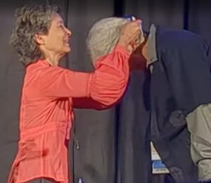 Beatrice Kondo presenting medallion to Sharon Lee